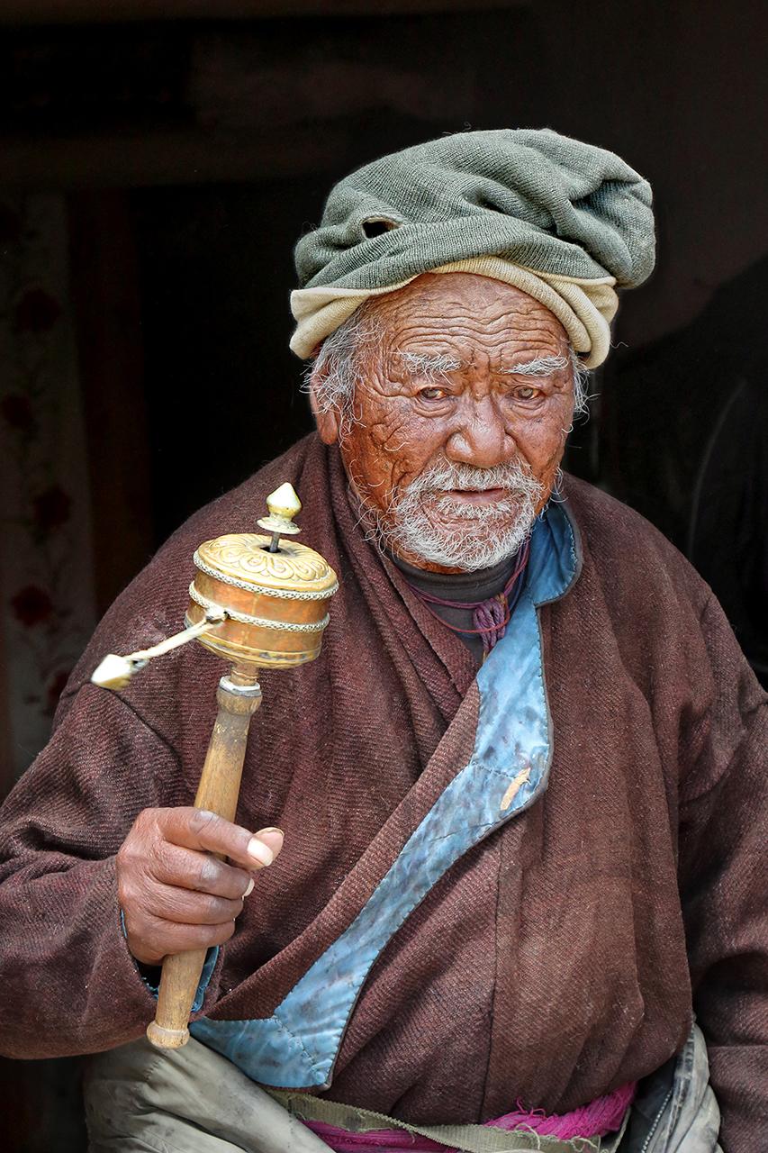 Old Man with prayer wheel